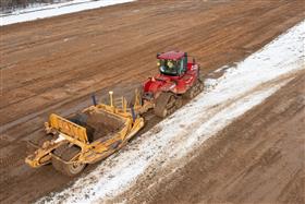 Pottstown Division: A Case IH 580 and KTec 1228 scraper pan strip top soil. 