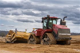 Landis C. Deck & Sons Division: A Case IH 540 QuadTrac pulls a KTec 1228 pan.