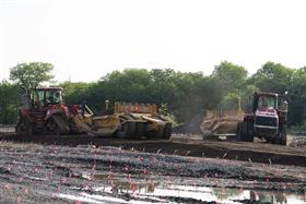 Haines & Kibblehouse, Inc.: Two Case IH QuadTracs work with KTec 1228 scrapers to move material around a site.