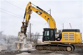 Haines & Kibblehouse, Inc.: A Caterpillar 349F processes a concrete beam on I-95.