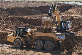 Pottstown Division: A Caterpillar 349F loads a Caterpillar 745 rock truck with dirt.