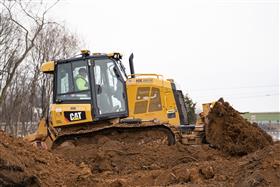 Pottstown Division: A Caterpillar D5K2 pushes soil up the stock pile.