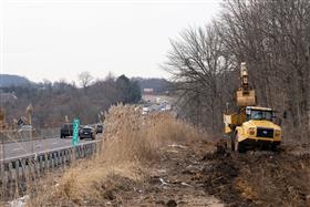 Pottstown Division: A Caterpillar 321D excavator loads a Caterpillar 735 truck with dirt.