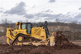 Pottstown Division: A Caterpillar D8T strips soil.