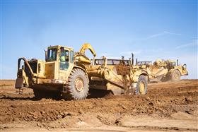 Pottstown Division: A  pair of Caterpillar scrapers work a cut.