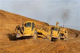 Landis C. Deck & Sons Division: Two Caterpillar scrapers work a cut. 