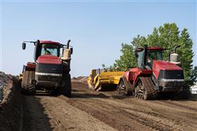 Haines & Kibblehouse, Inc.: Two Case IH QuadTrac tractors, equipped with KTec 1228 scrapers, work on a cut.