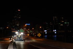 Haines & Kibblehouse, Inc.: A paving crew works on the eastbound lanes of I-76 with part of the City of Philadelphia in the background. 