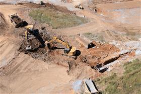 Harrisburg Division: A pipe crew works with along side an earth moving crew.