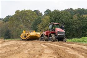 Landis C. Deck & Sons Division: A Case IH 540 QuadTrac pulling a K-tec 1228 scraper. 