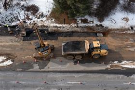 Pottstown Division: A pipe crew works in a roadway. 