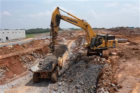 Harrisburg Division: A Komatsu PC650 excavator works a cut with a rock truck.