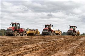 Pottstown Division: Three Case IH tractors equipped with KTec 1228 scrapers work a cut. 